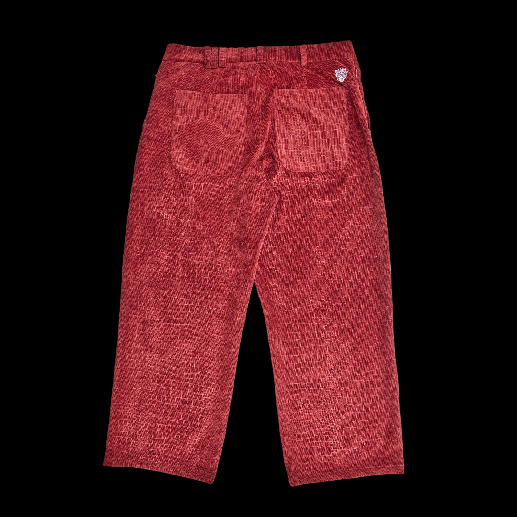 Red textured pants on a white background