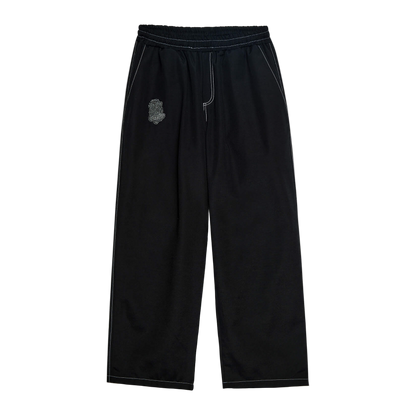 Black pants with a small logo on a white background